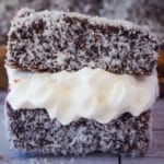 Lamingtons 40 Close up lamington filled with jam and cream.