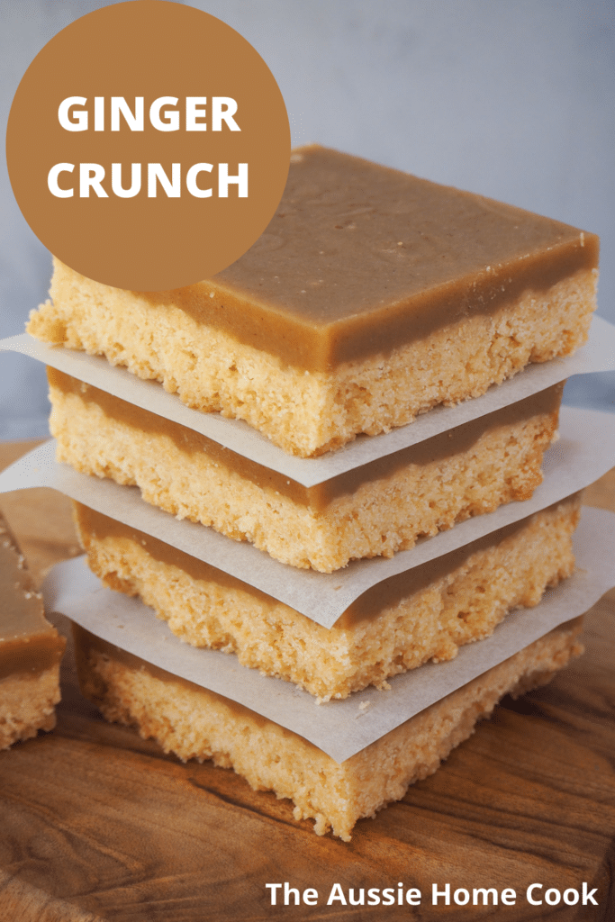 Ginger crunch 24 Stack of ginger crunch on a board, with text overlay, ginger crunch and The Aussie Home Cook.