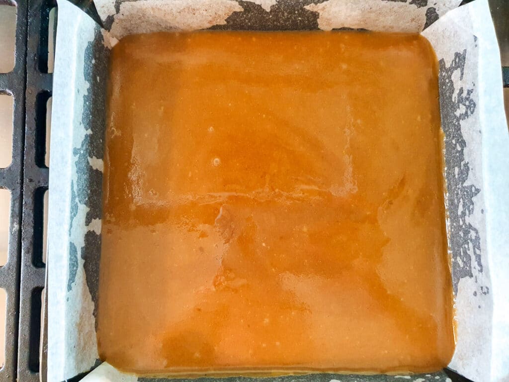 Ginger crunch 19 Base with icing poured over ready to set.