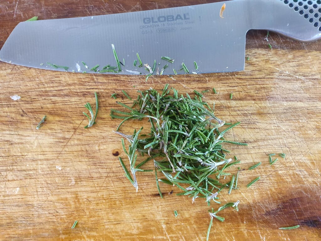 Slow cooker lamb ragu 12 Finely chopping fresh rosemary.