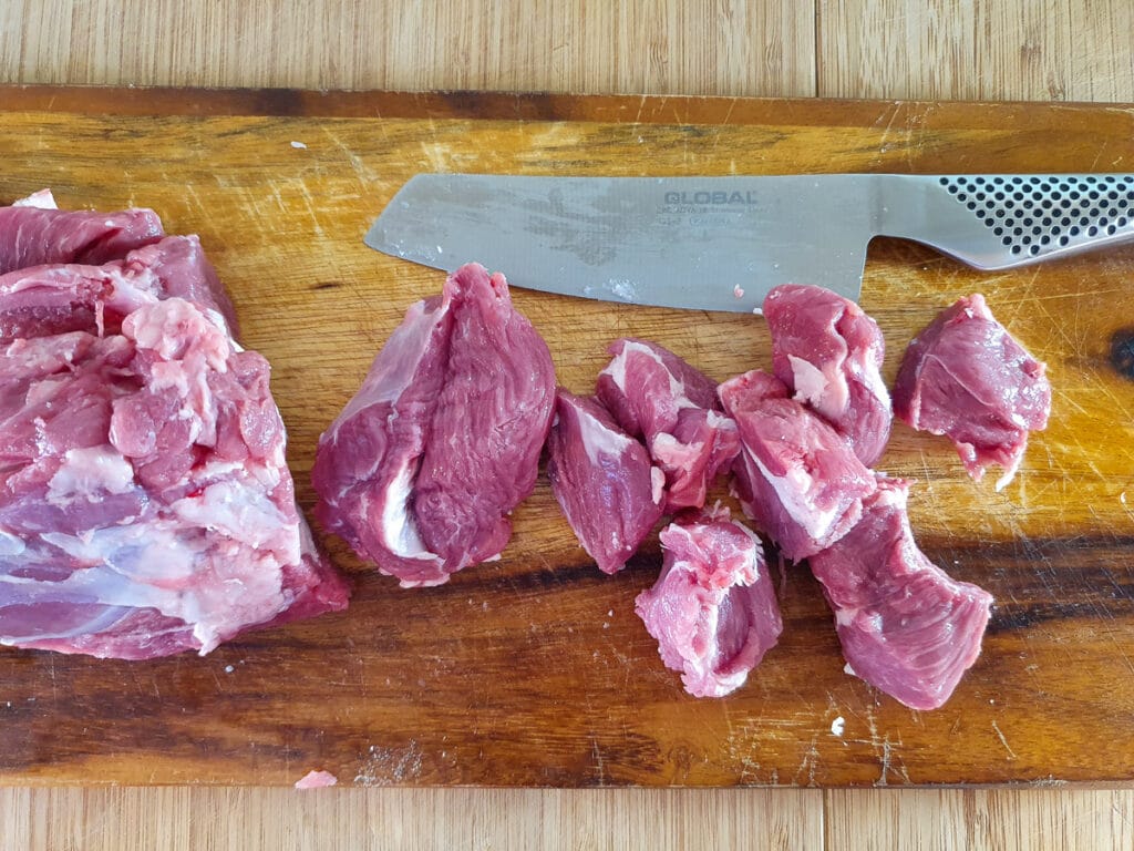 Slow cooker lamb ragu 8 Chopping the lamb into pieces.