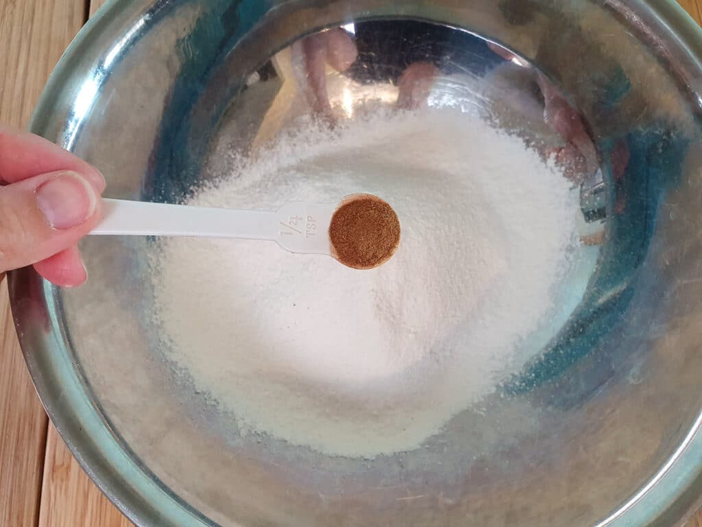 Banana pikelets 5 Adding cinnamon to dry ingredients.