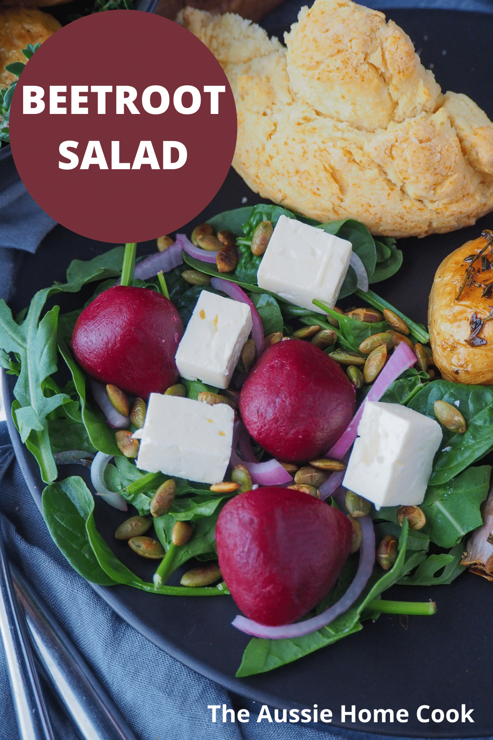 Beetroot salad 16 Beetroot salad on a plate, with damper and roasted mini potatoes on the side, with text overlay, beetroot salad, The Aussie Home Cook.