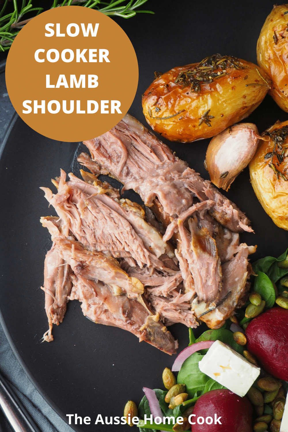 Slow cooker lamb shoulder 17 Slow cooker lamb shoulder server on a plat, with roast potatoes and beetroot salad on the side, with text overlay, slow cooker lamb shoulder, The Aussie Home Cook.