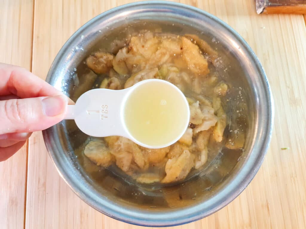 Feijoa muffins 9 Adding lime juice to feijoa flesh.