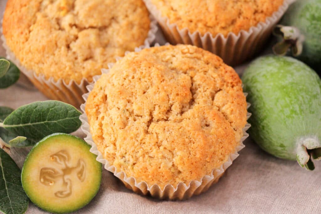 Feijoa muffins 1 Feijoa muffins with fresh feijoas and feijoa leaves.