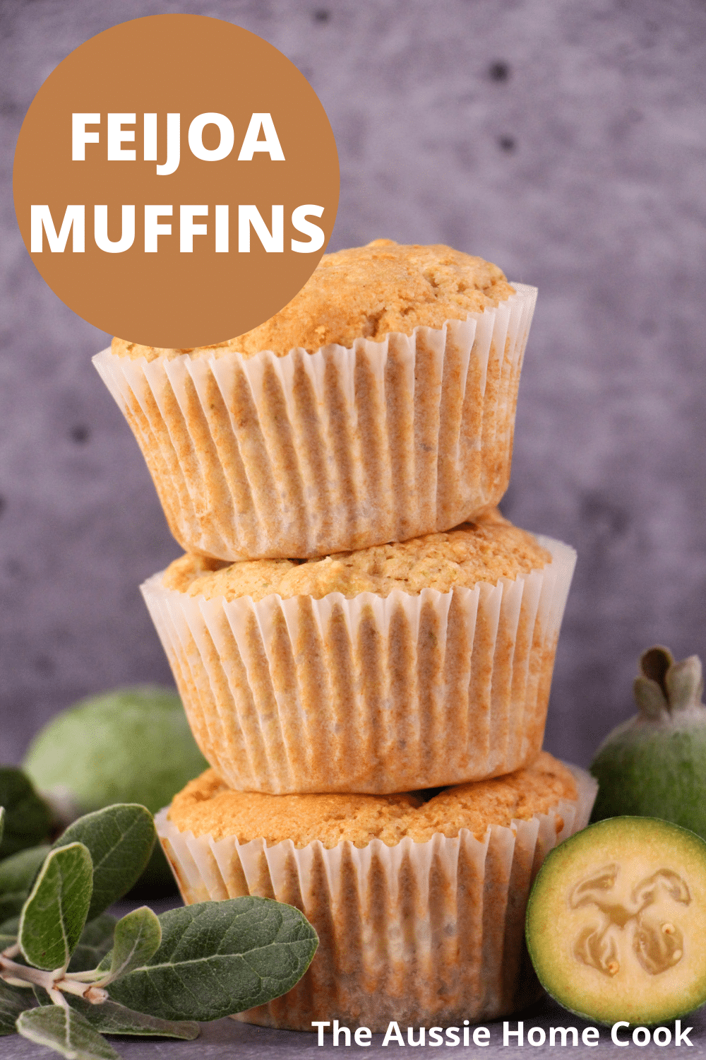Feijoa muffins 18 Stack of three feijoa muffins, with fresh feijoas and feijoa leaves and text overlay, feijoa muffins, the aussie home cook.