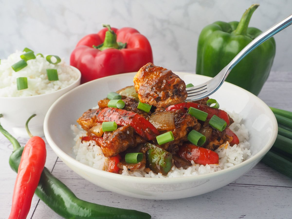 Chilli Chicken Gravy 22 Lifting a fork full of chicken.