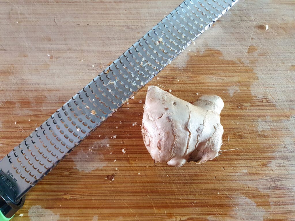 Chilli Chicken Gravy 8 Grating the ginger.