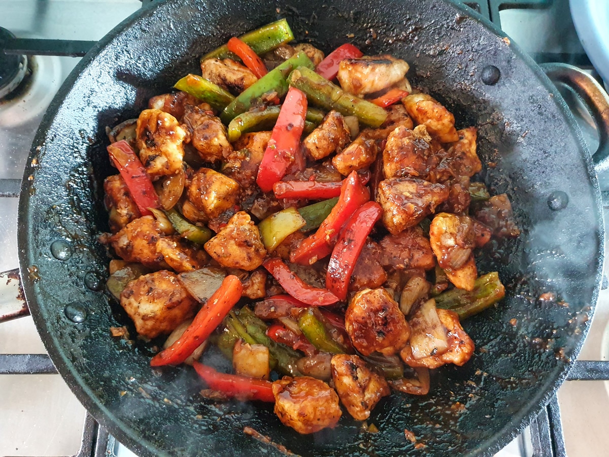 Chilli Chicken Gravy 21 Stirring to coat chicken and vegies in sauce.
