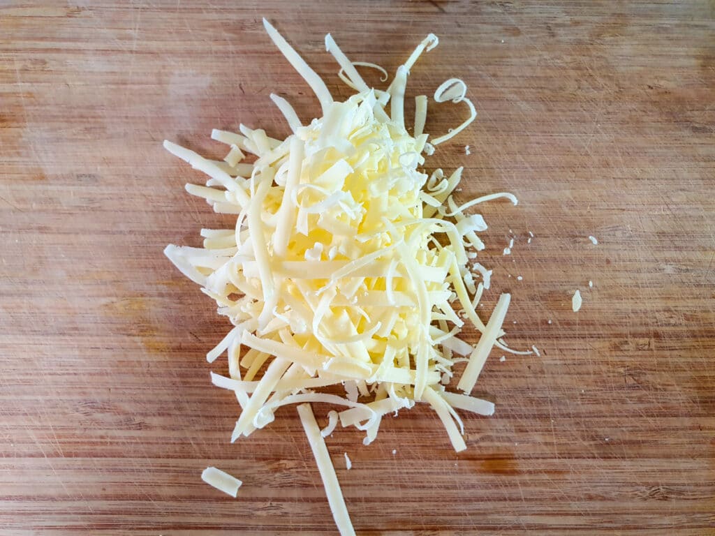 Cheesymite Scrolls 5 Grating cheese.