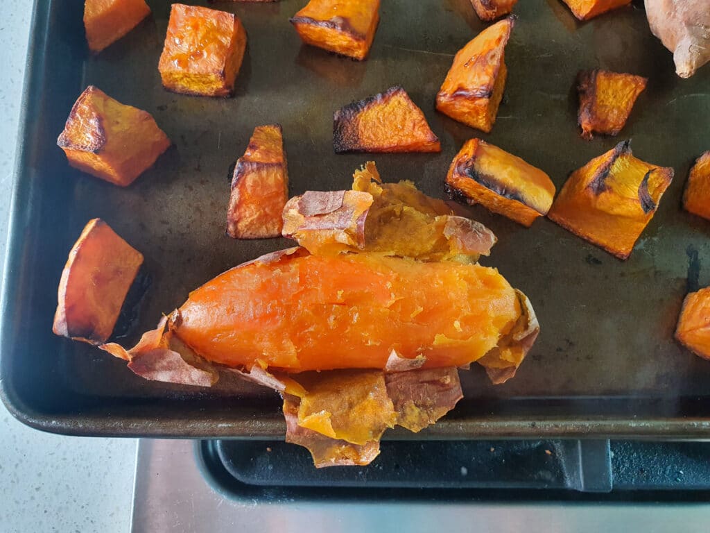 Pumpkin and Sweet Potato Soup 7 Peeling roasted sweet potato. The flesh should come away easily.