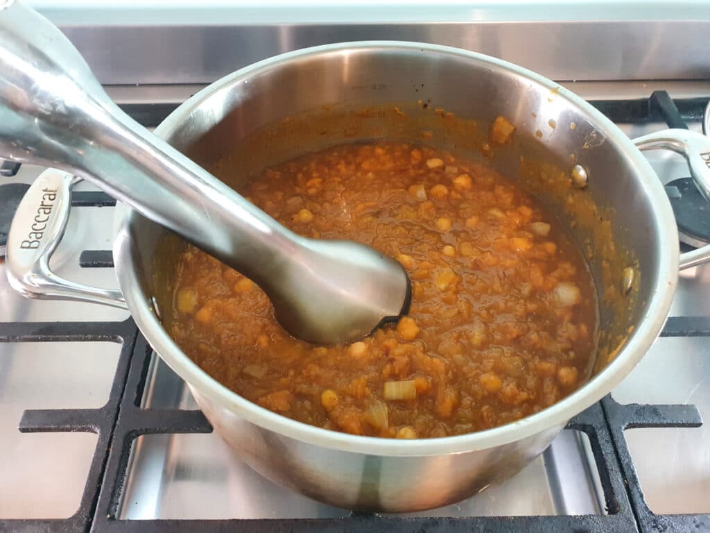 Pumpkin and Sweet Potato Soup 16 Blitzing the soup with an immersion/stick blender.