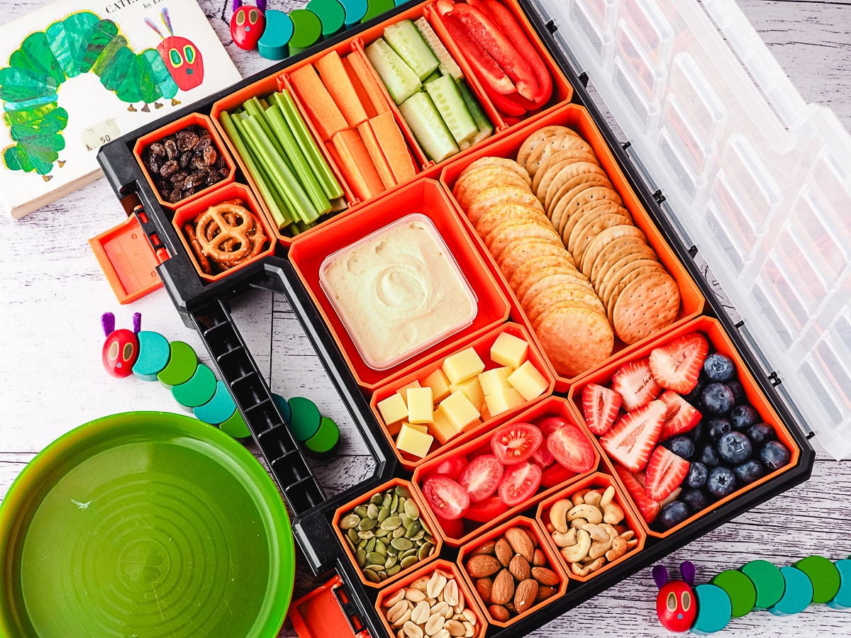 Kids Charcuterie Board 5 Charcuterie board with hungry caterpillar toys.