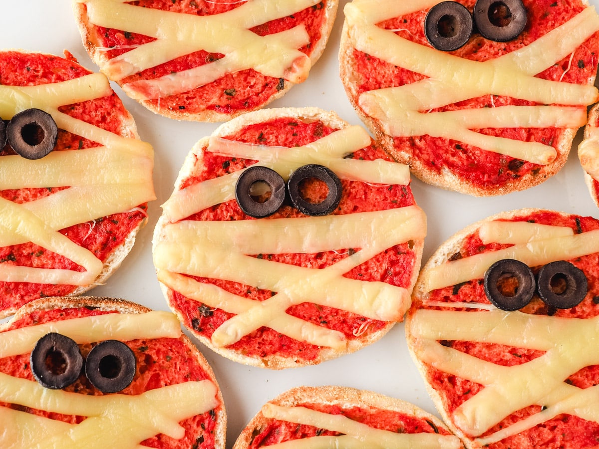 Mummy Pizzas 1 Top down view of mummy pizzas on a plate.