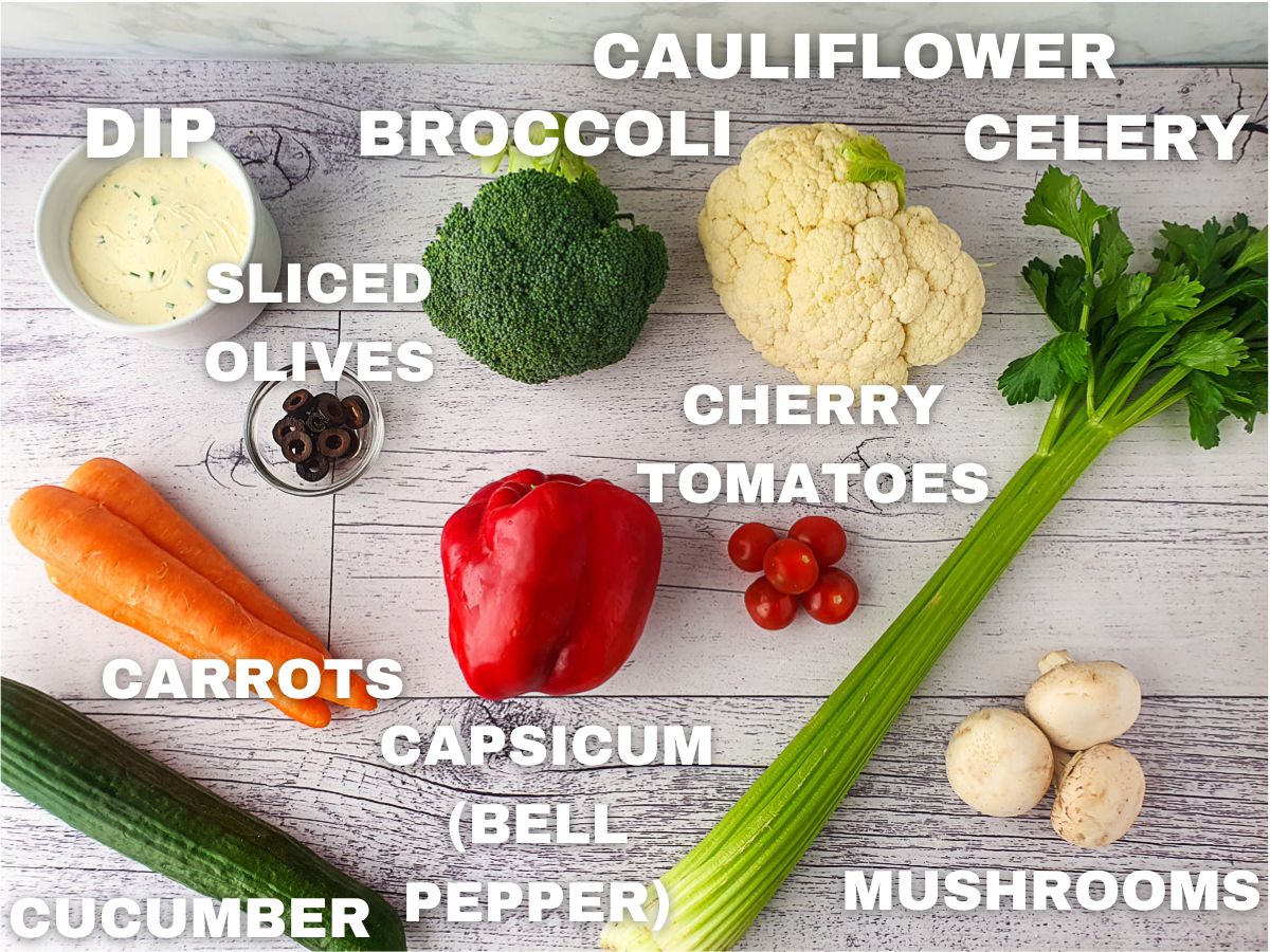 Skeleton Veggie Tray 3 Ingredients: dip, broccoli, cauliflower, celery, sliced olives, cherry tomatoes, carrots capsicum (bell pepper), cucumber, mushrooms.