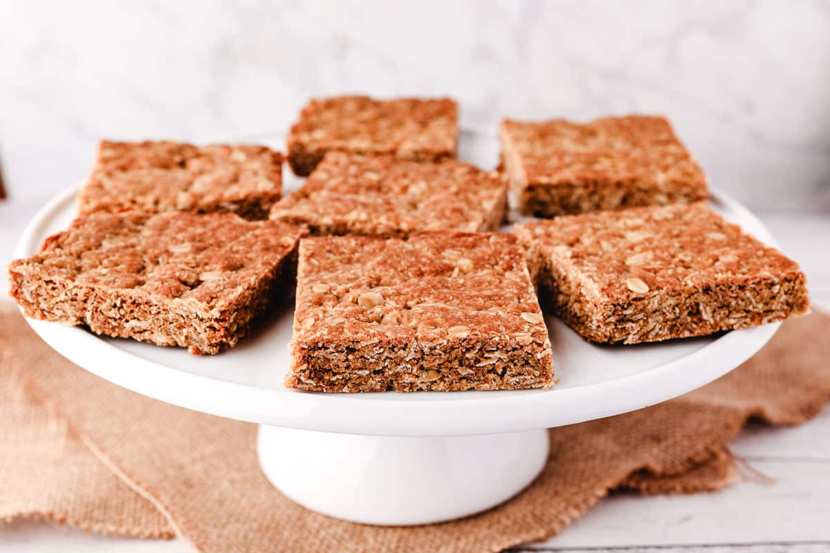Anzac Slice 5 Pieces of Anzac slice on a cake stand.